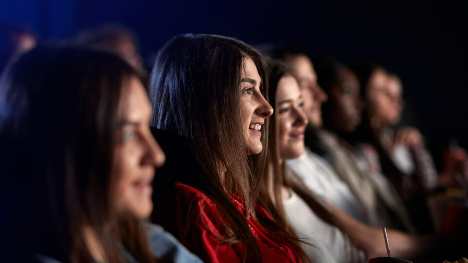 group of teenage girls at the movie theater