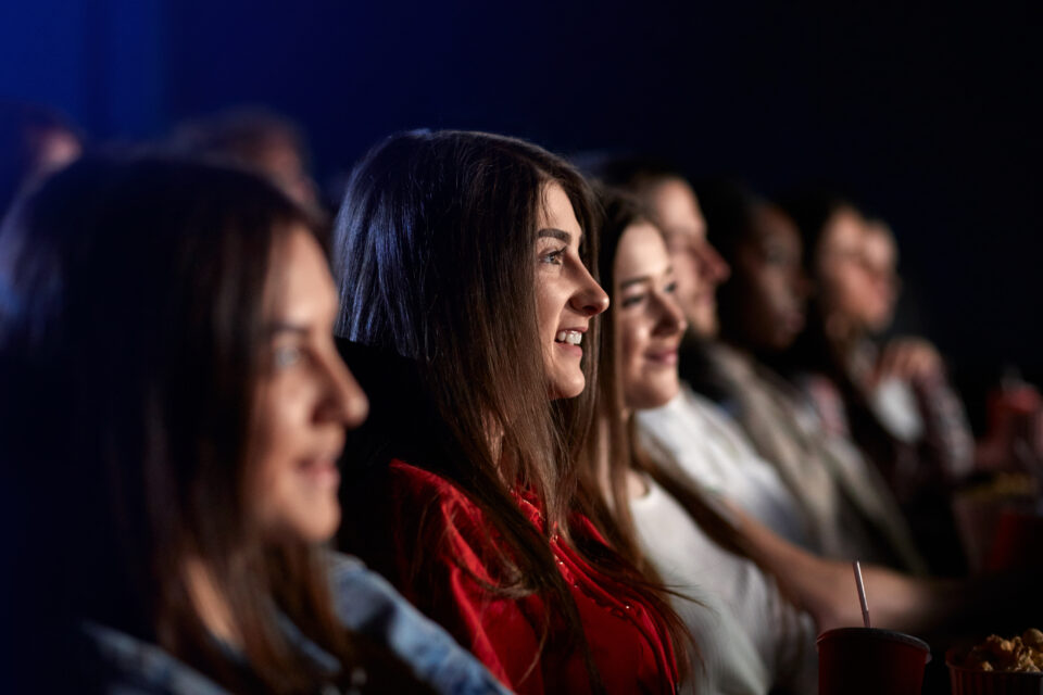 group of teenage girls at the movie theater