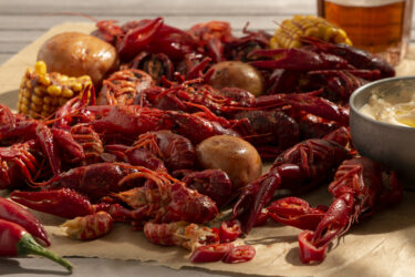 boiled crawfish platter with potatoes, corn, and sauce