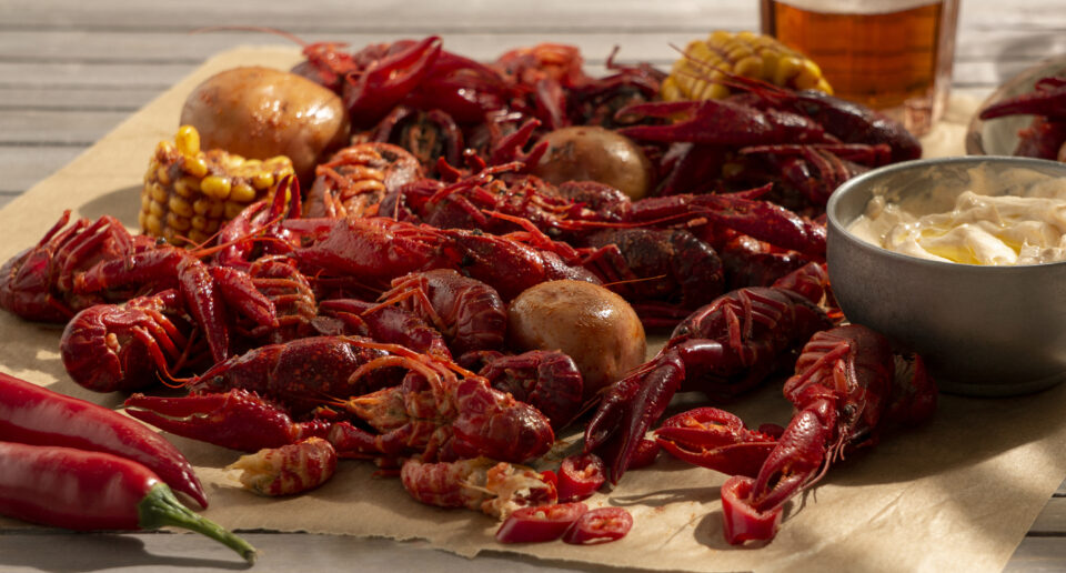 boiled crawfish platter with potatoes, corn, and sauce